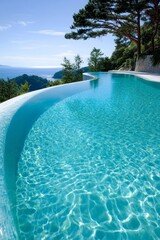 A large swimming pool with a view of the ocean