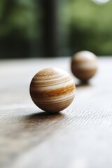 A couple of wooden balls sitting on top of a table