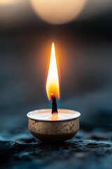 A lit candle sitting on top of a table