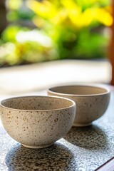 A couple of bowls sitting on top of a table