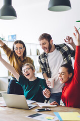 Excited students celebrating achievement together