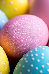 A bunch of brightly colored easter eggs with water droplets on them