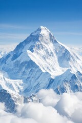 Obraz premium A snow covered mountain with a blue sky and clouds