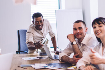 Positive multiracial group of coworkers smiling at camera