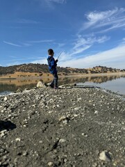 Fototapeta premium Boy fishing on the lake. 