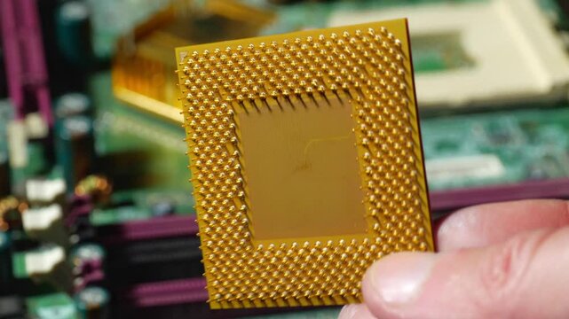 Close-up of a vintage microprocessor from the Windows 95 era, showcasing the technology that powered early personal computers. This iconic chip, with its intricate circuitry and distinctive design