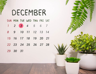 A set of white calendar blocks shows the date December 3