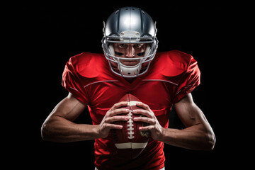 A man in a red football jersey is holding a football. Concept of strength and determination, as the man is ready to take on the challenge of the game