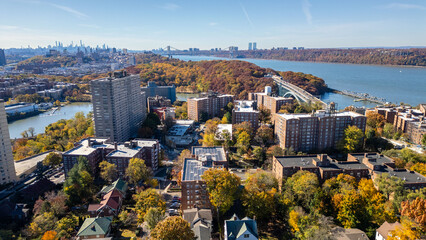 This location in the Bronx offers stunning views of lush greenery, a picturesque lake, and urban structures. Framed by the river, it showcases iconic bridges and the New York City skyline in the dista