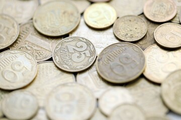 Big pile of different coins from various time period in Ukraine. Shiny Ukrainian money background
