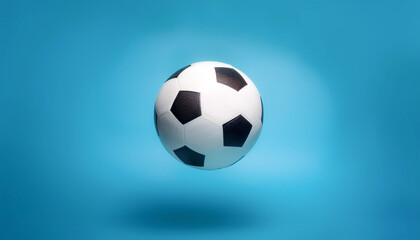 Naklejka premium White and black soccer ball floating or flying isolated on light blue background