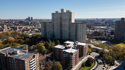 This location in the Bronx offers stunning views of lush greenery, a picturesque lake, and urban structures. Framed by the river, it showcases iconic bridges and the New York City skyline in the dista