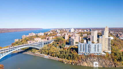 This location in the Bronx offers stunning views of lush greenery, a picturesque lake, and urban structures. Framed by the river, it showcases iconic bridges and the New York City skyline 