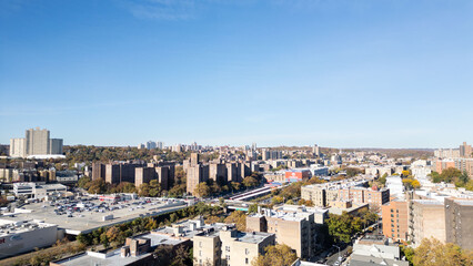 This location in the Bronx offers stunning views of lush greenery, a picturesque lake, and urban structures. Framed by the river, it showcases iconic bridges and the New York City skyline in the dista