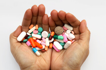 Colorful pills and medicines in the hand