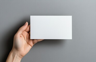 Obraz premium Blank card in hand emphasizing minimalism and creative expression