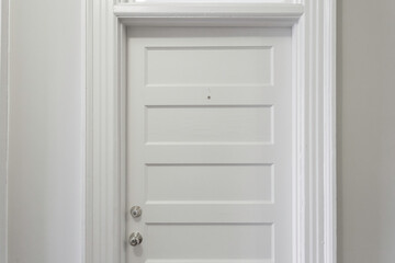 Classic White Door With Elegant Molding And Trim.