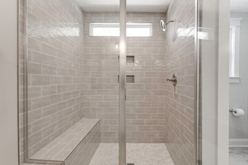 Modern Shower Area With Glass Doors And Gray Tiles