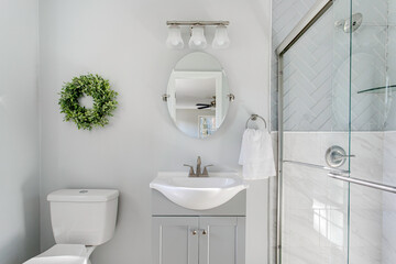 Elegant Bathroom With Sink, Mirror, And Glass Shower