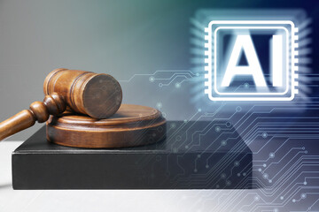 Artificial intelligence and law. Judge's gavel with book and AI abbreviation