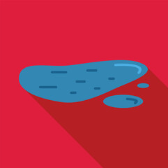 Water accumulating in a puddle on a red surface, reflecting light and creating small ripples