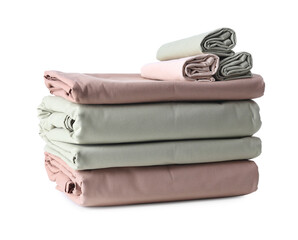 Stack of clean bed sheets isolated on white