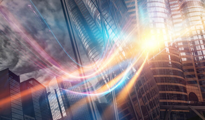An abstract city scene with bright glowing light trails streaking through the frame.