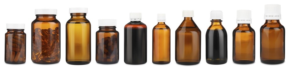 Many different glass bottles isolated on white