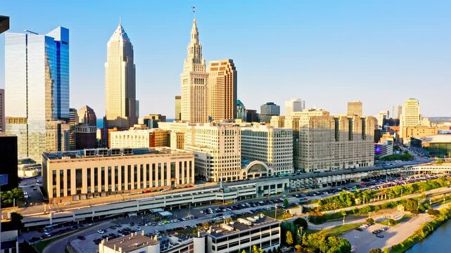 Aerial revealing shot of Cleveland, Ohio skyline at sunset. Cleveland is a major city in the U.S. state of Ohio and the county seat of Cuyahoga County.