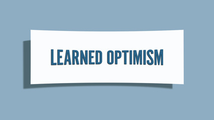 Learned Optimism.. A card isolated on blue background.