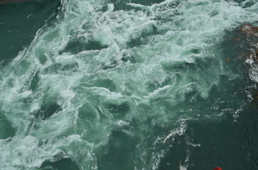 Fototapeta premium Stunning aerial view of Niagara Falls, rapids on the Niagara River in Canada and New York. American Side, Canadian Side. Gorgeous nature, one of the seven wonders. 