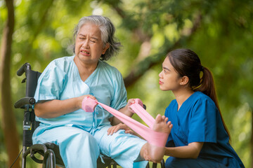 Obraz premium Healthcare or physical therapy nurse is helping elderly appears relaxed listen music engaged in an exercise routine caregiver individuals focused on rehabilitation exercises elder concept.