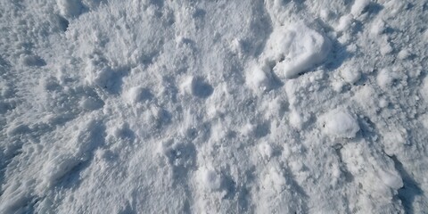 Obraz premium Natural snow texture top view. surface of the snow crust. Snowy ground. Winter background with snow patterns, banner template Merry Christmas and Happy New Year