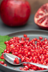 Vertical image of prepared pomegranate seeds.