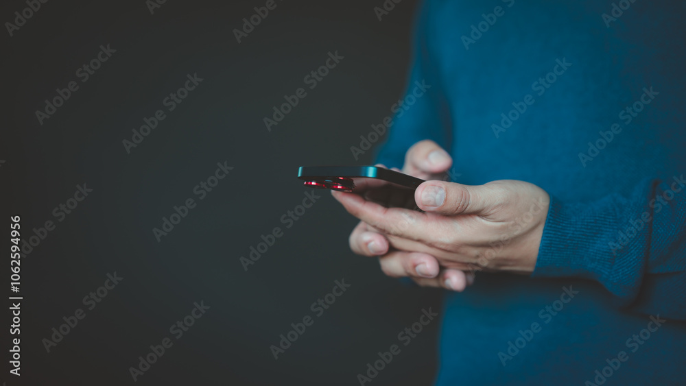 Poster a person holds a smartphone with a focus on the screen device. the concept highlights mobile technol