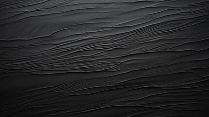 A Blank Black Wallpaper with Rough Cardboard Texture and Matte Finish Surface for a Dark Aesthetic