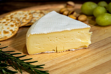 A big block of cheese that everyone likes to eat.