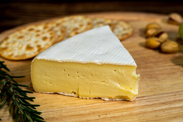 A big block of cheese that everyone likes to eat.