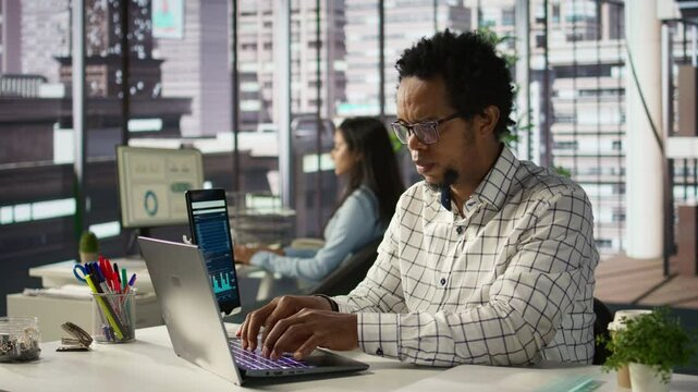 General manager sits at his laptop frustrated by the overload of business tasks. CEO dealing with fatigue and mental exhaustion after experiencing pressure in the office environment. Camera B.