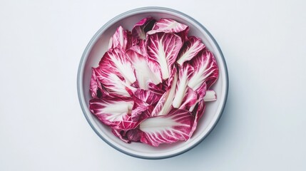 Top view of radicchio in a simple bowl, isolated on bright white