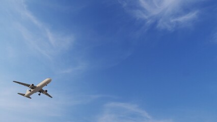 ULTRA HD. Airplane flies in blue sky. Travel. Airplane takes off against the background of blue sky. 