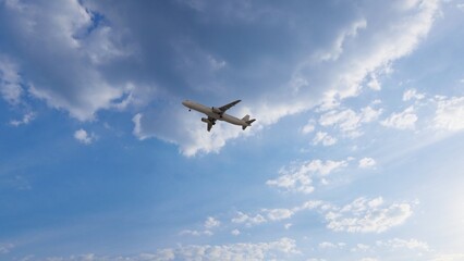 ULTRA HD. Airplane flies in blue sky. Travel. Airplane takes off against the background of blue sky.	
