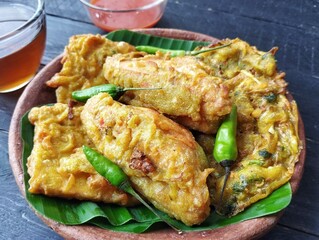 Gorengan or Indonesian traditional foods on the wooden table 