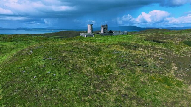 Inoperative lighthouse on a green island in the middle of the Atlantic Ocean 