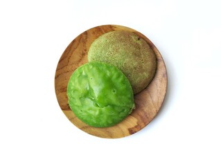 Serabi hijau or Indonesian traditional cake made from rice flour mixed coconut palm sugar isolated on white background 