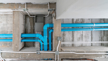 Sewerage system, blue PVC pipes at the construction site.
