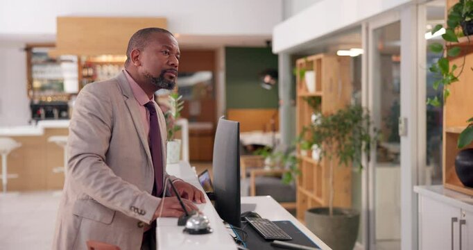 Frustrated, black man and reception with bell at hotel for assistance, delay or waiting to check in. Angry, impatient and annoyed male guest at front desk of accommodation for bad hospitality service
