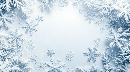 Snowflakes on smooth white surface, top view with blank area for text