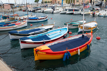 Obraz premium Traditional colorful fishing boats, called pointu in French. in Nice Port, Nice, France on sunny summer day.