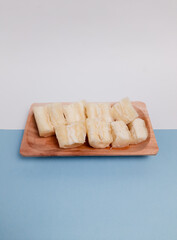 Boiled cassava or singkong rebus served in wooden plate. One of the Healthy food